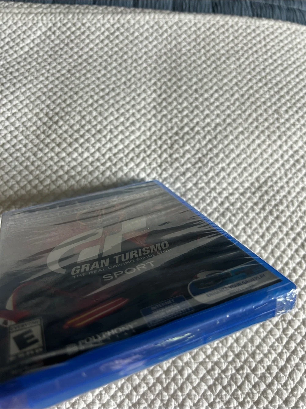 Sony PlayStation 4 Game Case with Red and Black Racing Artwork